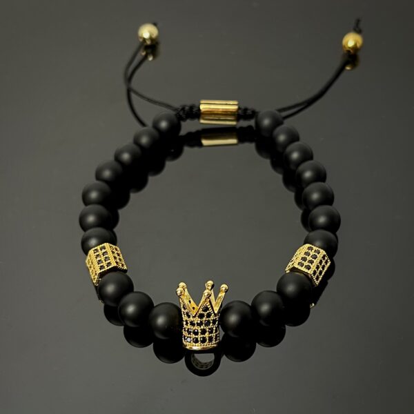 Fekete arany színű koronas karkötő